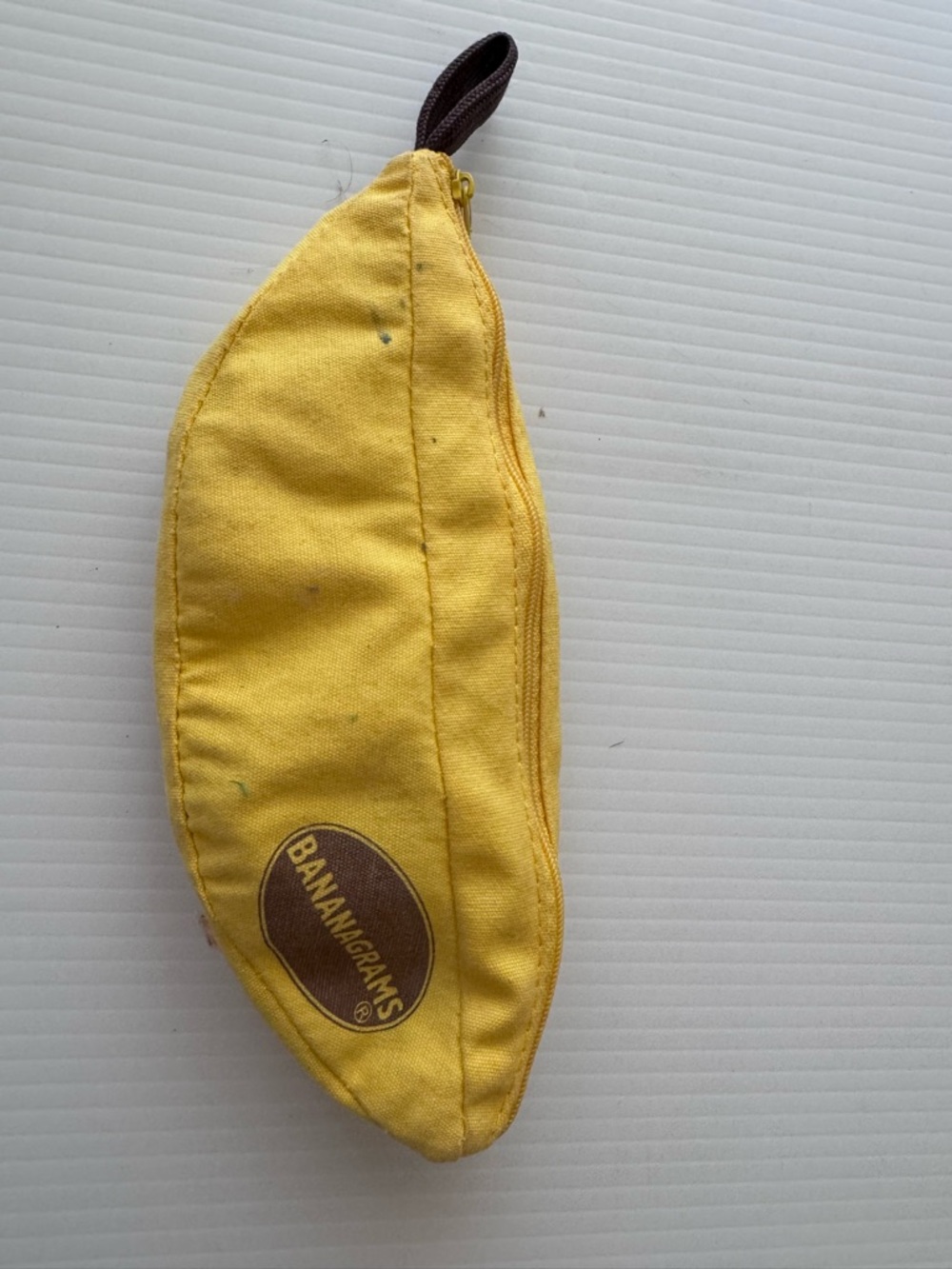 BananaGrams Yellow Banana-Shaped puzzle Kids Pouch with letter blocks inside